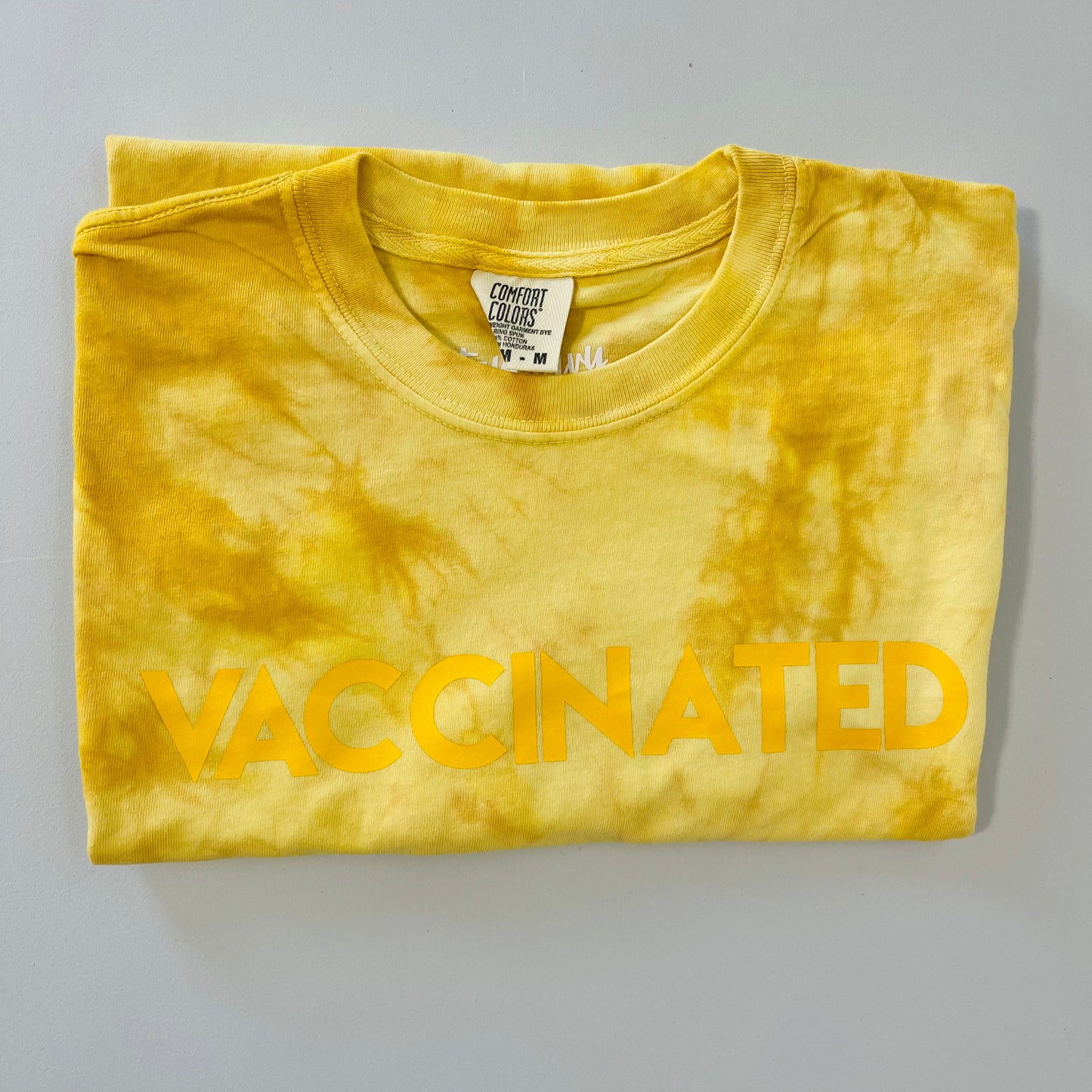 Golden Tie Dye VACCINATED Tee