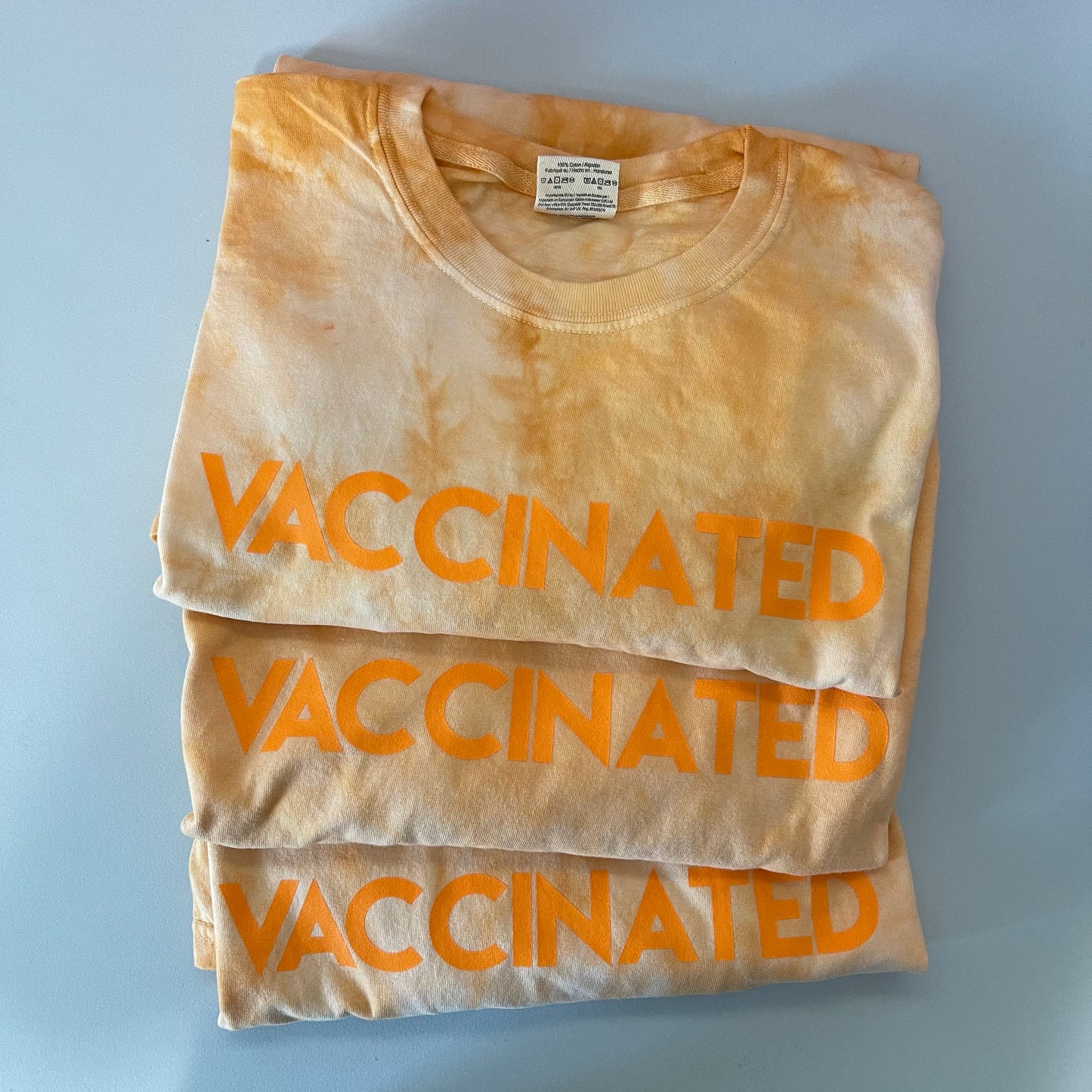 Orange Tie Dye VACCINATED Tee